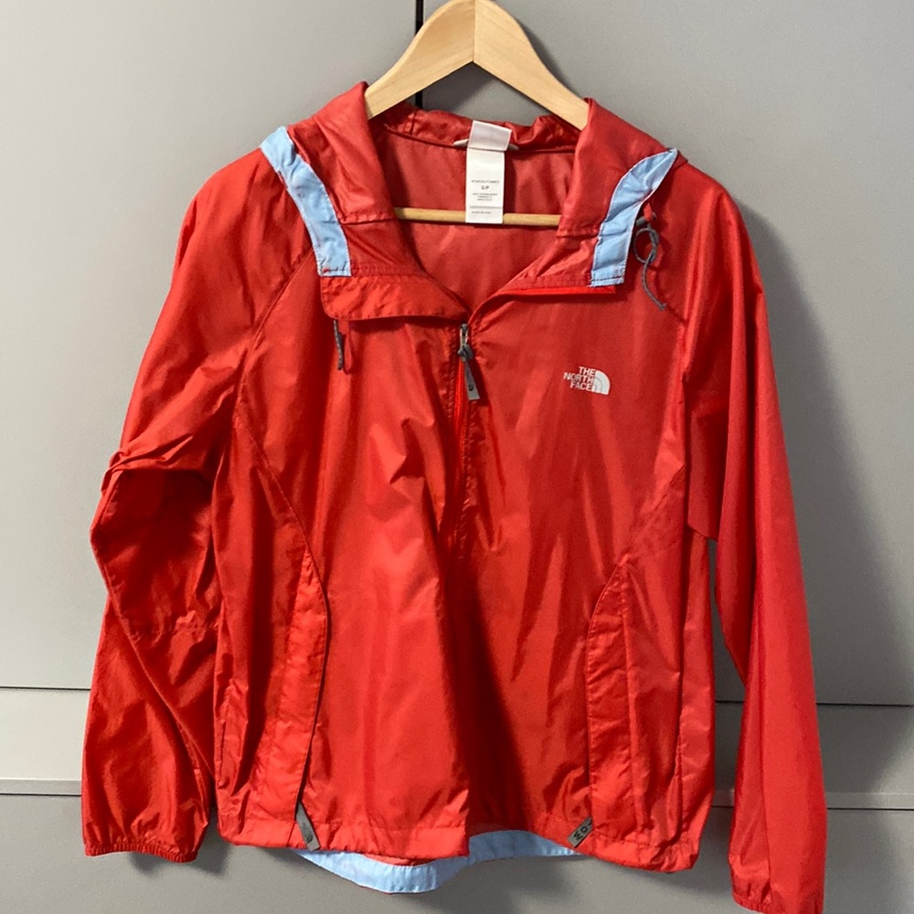 North Face women windbreaker . Red and Pink Never been worn. Size Small